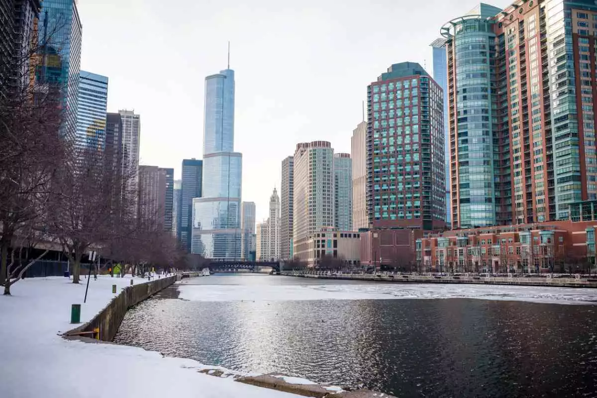 A snowy chicago lake with downtown in the background