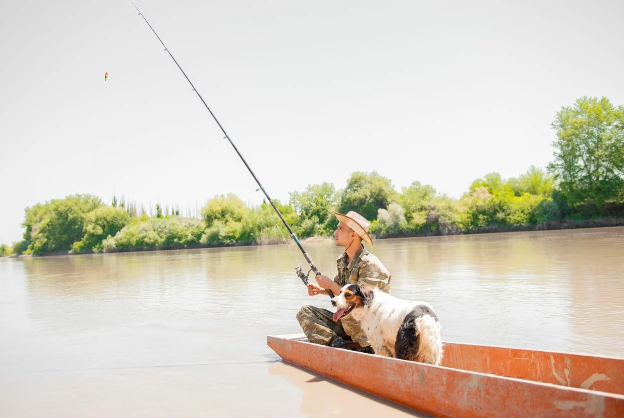 A man floats along while freshwater fishing in Florida.