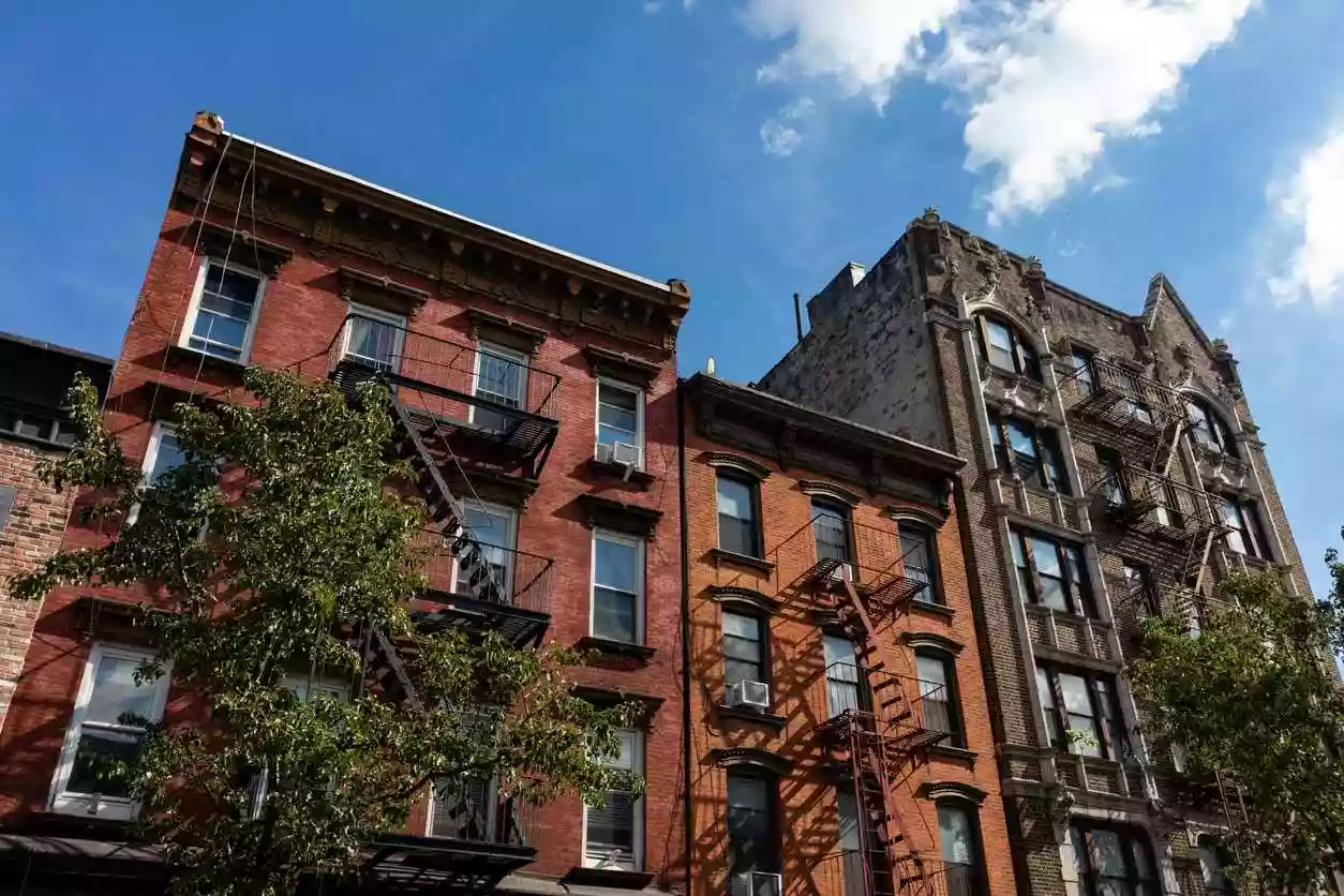 A row of historic brick buildings in Williamsburg, a neighborhood in Brooklyn, NY.